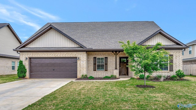 view of front of house with board and batten siding, driveway, brick siding, a front lawn, and an attached garage