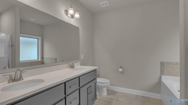 bathroom with a sink, baseboards, tile patterned floors, and visible vents
