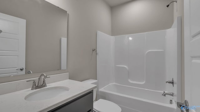 bathroom with toilet, washtub / shower combination, and vanity