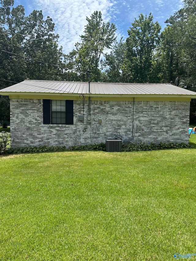 view of home's exterior with a yard