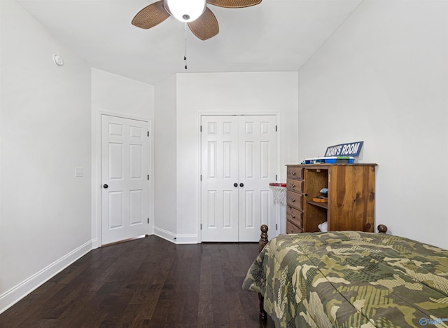 bedroom featuring a ceiling fan, a closet, baseboards, and wood finished floors