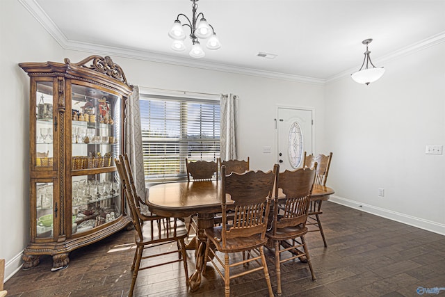 dining area featuring ornamental molding, dark wood-type flooring, baseboards, and a chandelier