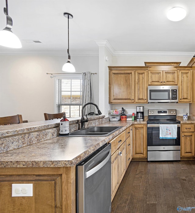 kitchen with visible vents, ornamental molding, appliances with stainless steel finishes, dark wood-type flooring, and a sink