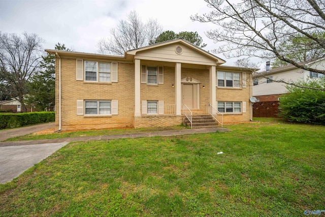 split foyer home with a front lawn