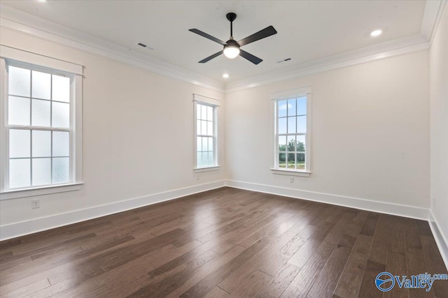 spare room with dark hardwood / wood-style flooring, ceiling fan, and ornamental molding