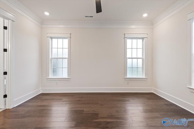 empty room with dark wood-type flooring and crown molding