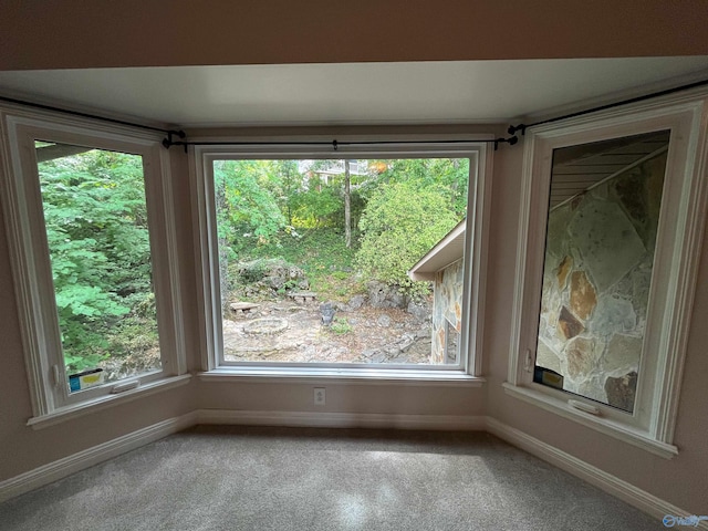 unfurnished room featuring baseboards