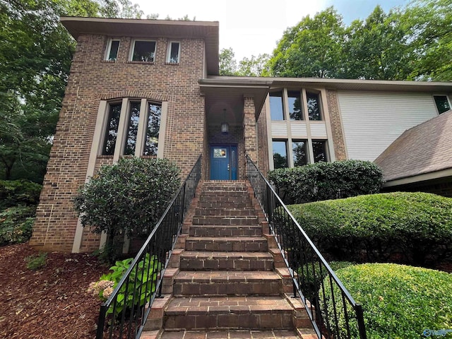 view of front of home with brick siding