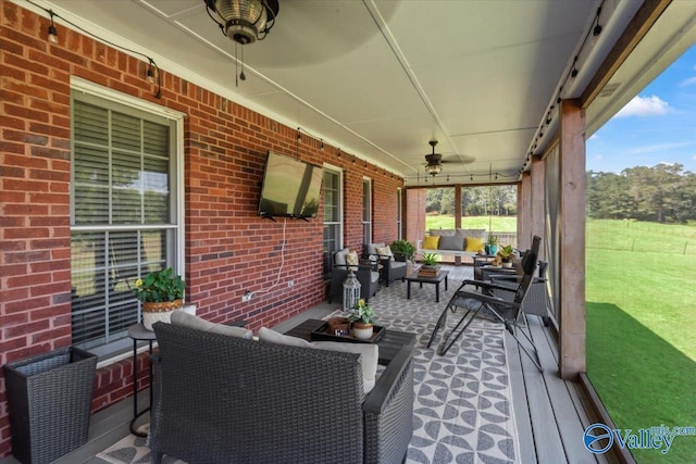exterior space featuring covered porch, an outdoor hangout area, and a ceiling fan
