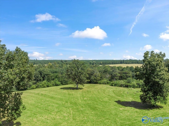 exterior space with a wooded view