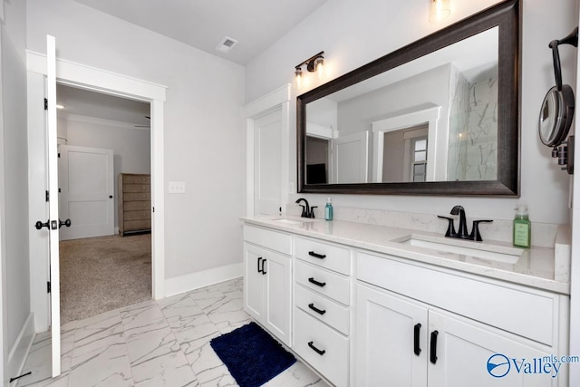 full bathroom with baseboards, visible vents, marble finish floor, and a sink