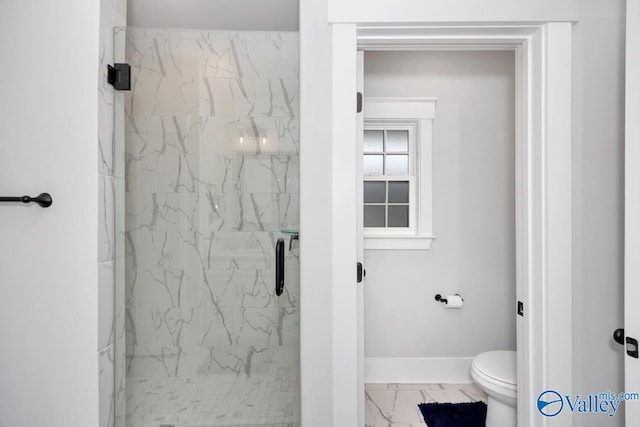 full bathroom featuring a shower stall, marble finish floor, baseboards, and toilet
