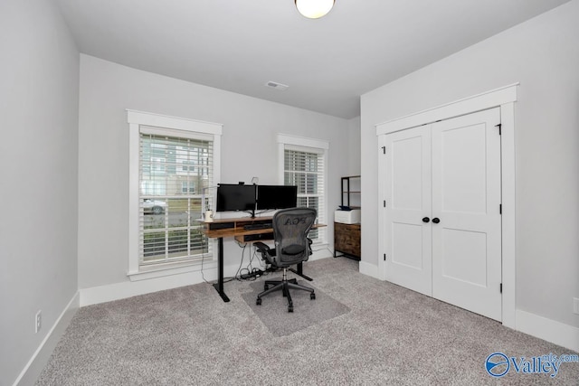 carpeted home office with baseboards and visible vents