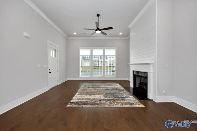 unfurnished living room featuring crown molding, baseboards, and a ceiling fan