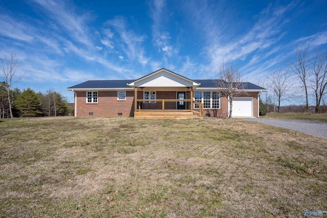 ranch-style home with an attached garage, covered porch, brick siding, crawl space, and gravel driveway