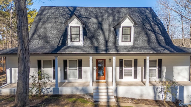 cape cod-style house featuring a porch