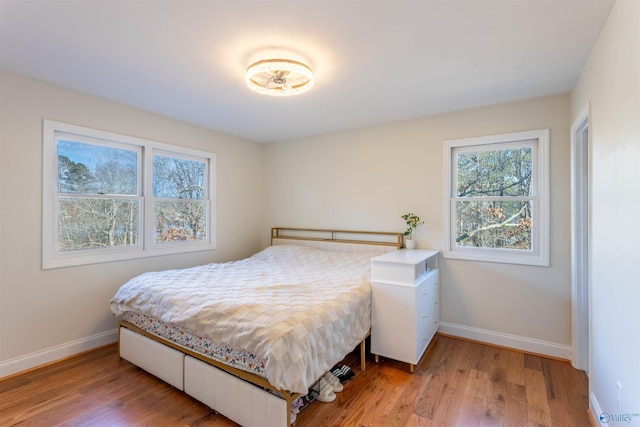 bedroom with wood-type flooring