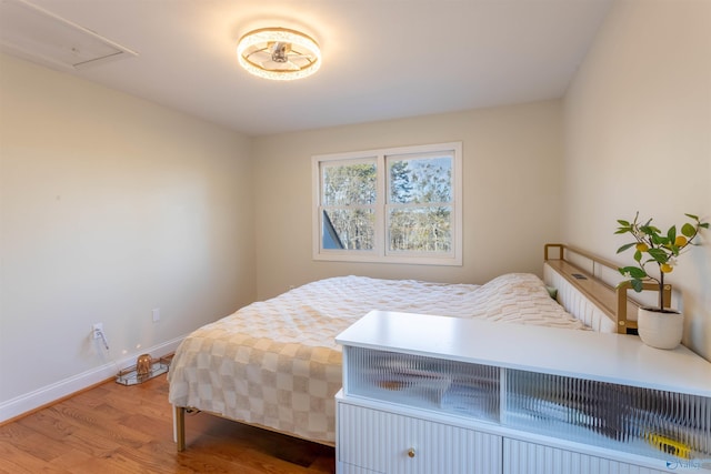 bedroom with hardwood / wood-style floors