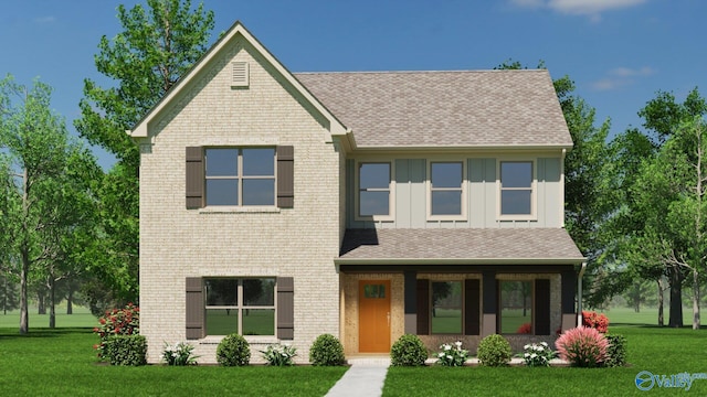 view of front of house with roof with shingles, a front lawn, board and batten siding, and brick siding