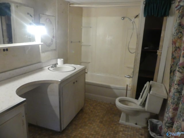 full bathroom with vanity, shower / bath combo with shower curtain, tile patterned flooring, and toilet