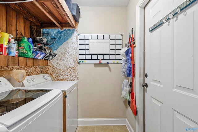 washroom featuring separate washer and dryer and light tile patterned floors