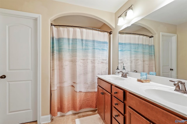 bathroom featuring tile patterned floors and vanity