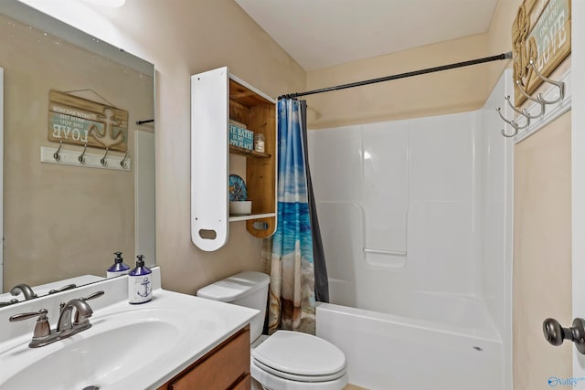 full bathroom featuring shower / tub combo, vanity, and toilet