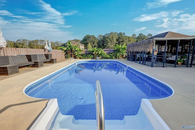 view of swimming pool featuring a patio