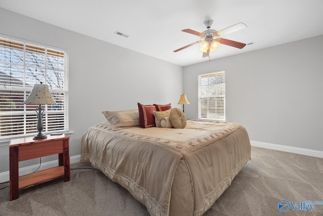 bedroom with ceiling fan and carpet