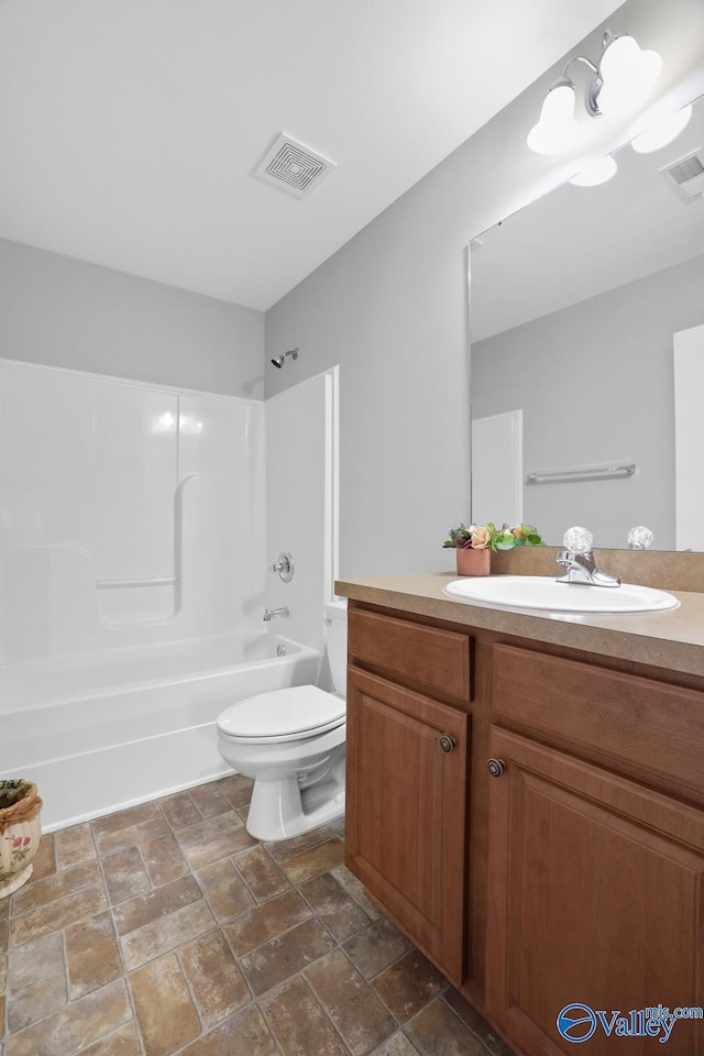 full bathroom featuring toilet, vanity, and shower / tub combination