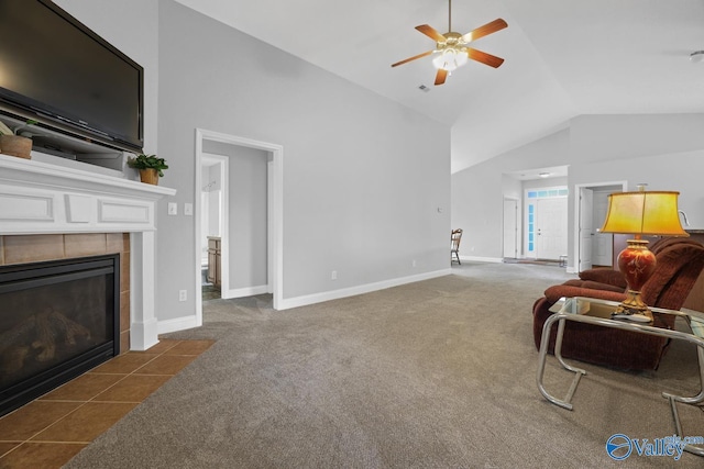 living room featuring ceiling fan, lofted ceiling, a fireplace, and dark carpet