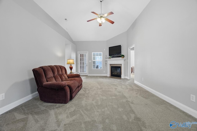 carpeted living room featuring high vaulted ceiling and ceiling fan