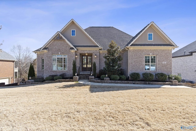 craftsman-style house with a front yard