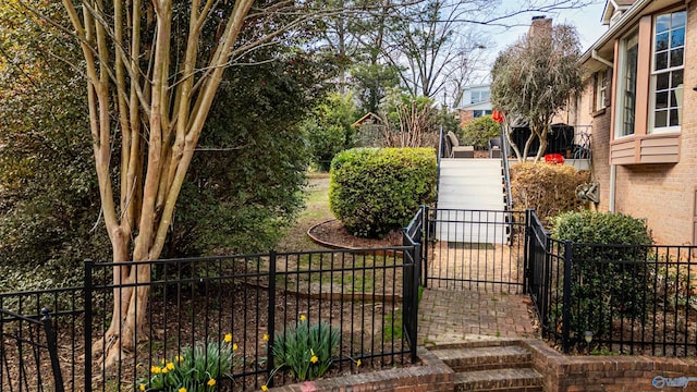 view of gate featuring fence