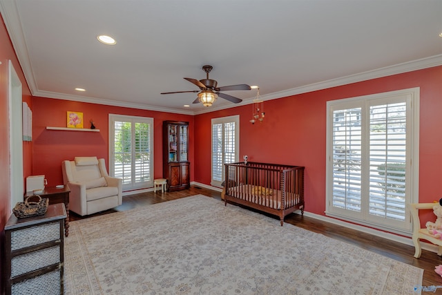 bedroom featuring recessed lighting, crown molding, and wood finished floors