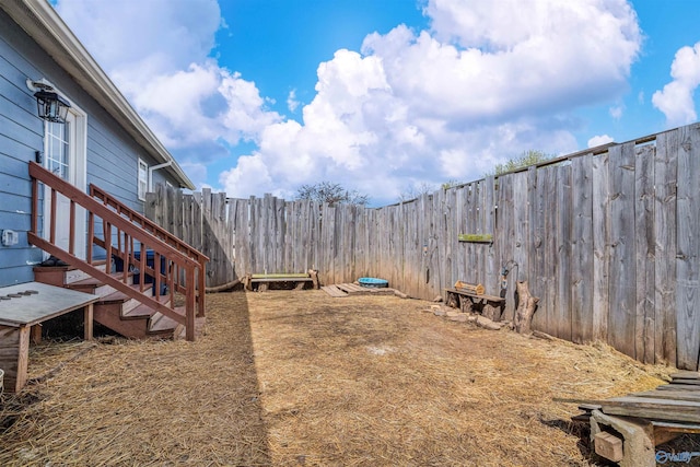 view of yard with a fenced backyard