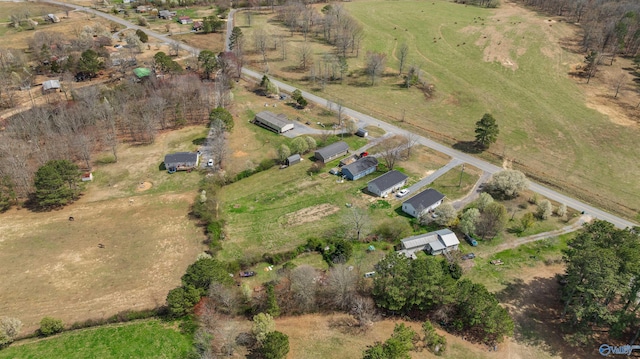 birds eye view of property featuring a rural view