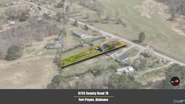 birds eye view of property featuring a rural view