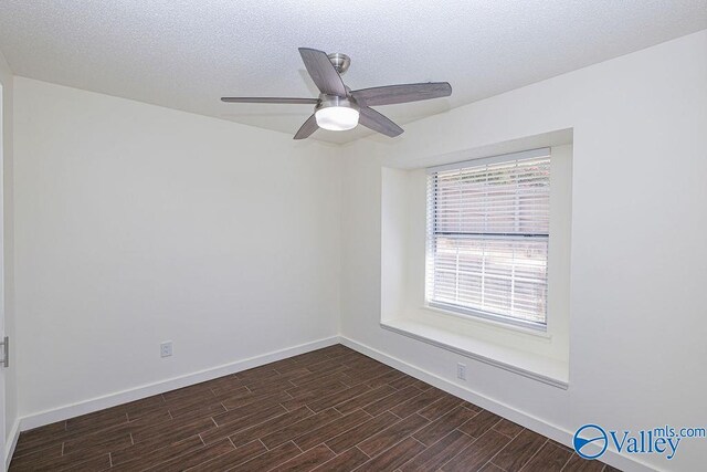 empty room featuring a textured ceiling, ceiling fan, and hardwood / wood-style floors