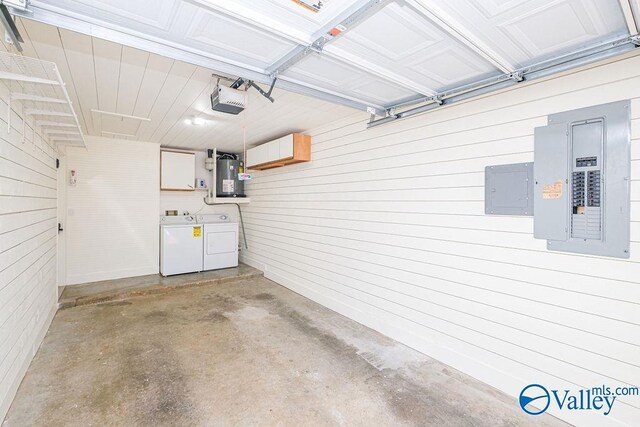 garage with separate washer and dryer, a garage door opener, water heater, and electric panel