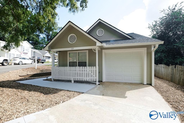 view of front of house with a garage and covered porch