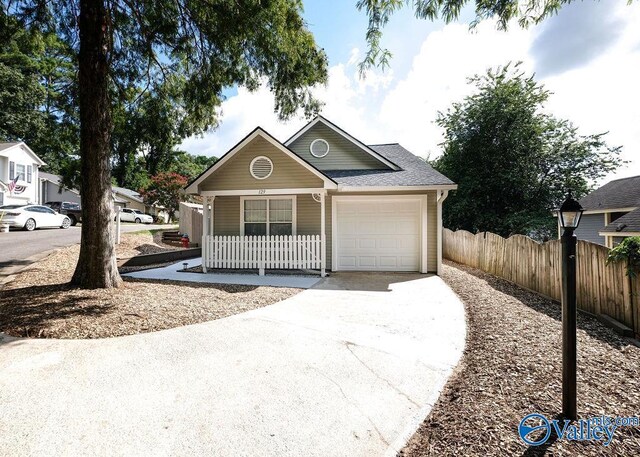 view of front of property featuring a garage and covered porch