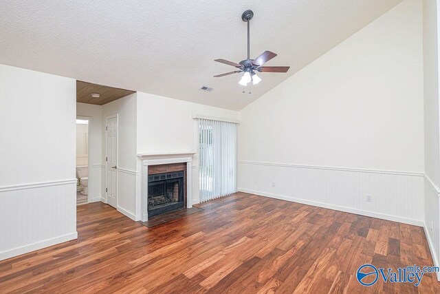 unfurnished living room with ceiling fan, high vaulted ceiling, and wood-type flooring