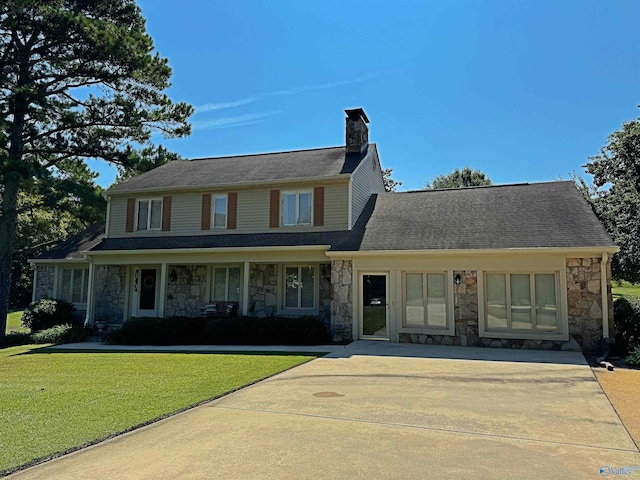 view of front facade with a front yard and a porch