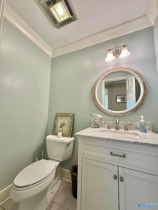 bathroom with vanity, toilet, and ornamental molding