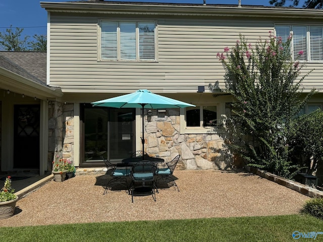 rear view of property featuring a patio