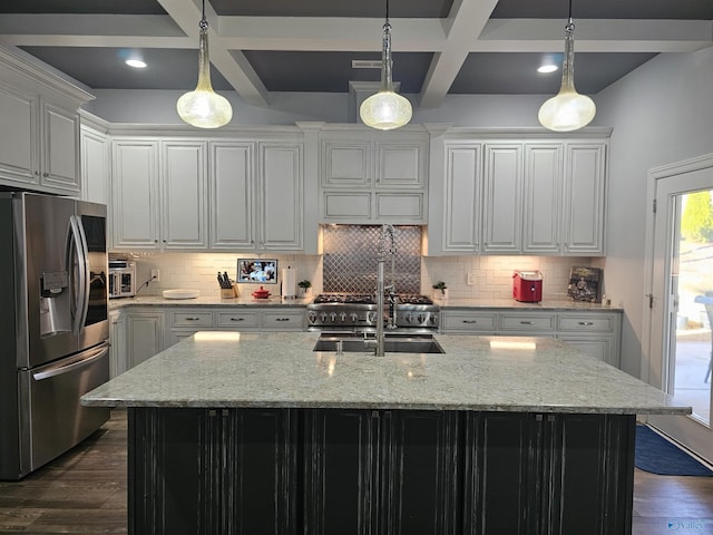 kitchen featuring stainless steel refrigerator with ice dispenser, coffered ceiling, an island with sink, and light stone counters