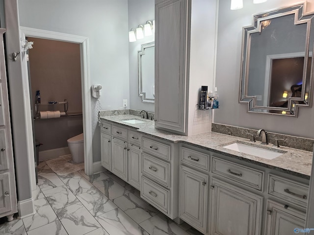 bathroom with vanity and toilet