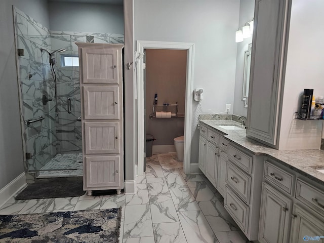 bathroom featuring walk in shower, vanity, and toilet