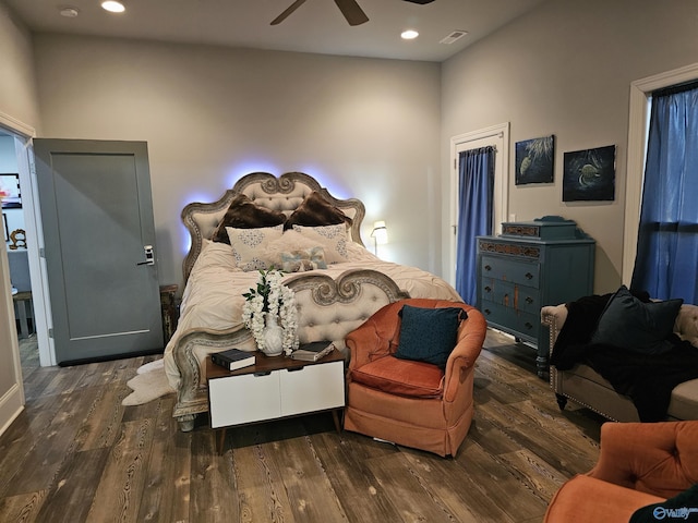 bedroom featuring dark hardwood / wood-style flooring and ceiling fan